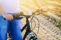 Bicycle and man on nature close up, travel, healthy lifestyle, country walk. bicycle frame. sunny day Royalty Free Stock Photo