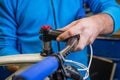 Bicycle mechanic assembling a bicycle stem on a fork tube