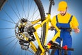 Bicycle mechanic straightening handlebar Royalty Free Stock Photo
