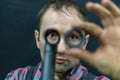 A bicycle mechanic in the workshop holds a frame from an old bicycle in his hands. Checking bicycle parts for wear, replacing Royalty Free Stock Photo