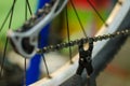 Bicycle mechanic in the workshop in the repair process holds the tool in his hand. Replacing the bicycle chain Royalty Free Stock Photo