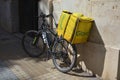 Bicycle of a messenger from the delivery company Glovo on a street in Valencia (Spain