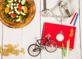 bicycle model, salad of fresh vegetables, red notepad, stopwatch Royalty Free Stock Photo