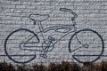 Bicycle mural on exterior wall background .