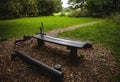 Bicycle near bench and pond in park Royalty Free Stock Photo