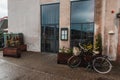 Bicycle near flowerpots and facade of Royalty Free Stock Photo