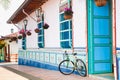 Bicycle next to a beautiful blue and white house at Guatape