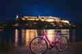 Bicycle on the Novi Sad embankment overlooking the Petrovaradin fortress, night shot, travel to Serbia, Balkan countries