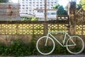 Bicycle and old fence cement with corrugated iron which as the background. Royalty Free Stock Photo