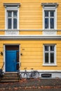 Bicycle and an old yellow house in the Bergen old town Royalty Free Stock Photo