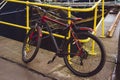 Bicycle padlocked to a yellow rail in Fraserburgh Harbour,Aberdeenshire, Scotland, UK. Royalty Free Stock Photo