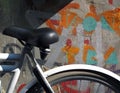 Bicycle Parked Against a Graffiti Painted Wall