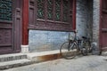 A bicycle parked against an ornamented wall in the Great Mosque in the city of Xian, China