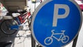 Bicycle parked on the bike parking under overpass near road