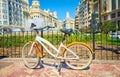 Bicycle parked on a city street. Cycling or commuting in the urban environment, ecological transport concept Royalty Free Stock Photo