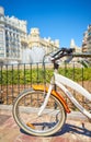 Bicycle parked on a city street. Cycling or commuting in the urban environment, ecological transport concept Royalty Free Stock Photo