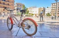 Bicycle parked on a city street. Cycling or commuting in the urban environment, ecological transport concept Royalty Free Stock Photo