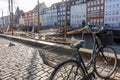 Bicycle parked on cobblestone footpath along the Nyhavn Canal Royalty Free Stock Photo