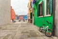 Bicycle parked long an external wall in Burano island, Venice Royalty Free Stock Photo