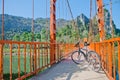 Bicycle parked on the orange bridge