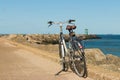 Bicycle parked on Scheveningen harbour entance wall