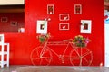 Bicycle parking front of red wall