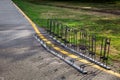 Bicycle parking iron frame on an asphalt road. Royalty Free Stock Photo