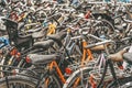 Bicycle parking with lot of bicycles, rainy day, urban iconic transport in Amsterdam. Royalty Free Stock Photo