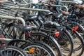 Bicycle parking lot in the city street of Amsterdam, Netherlands. Iconic transport in Amsterdam Royalty Free Stock Photo