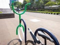 Bicycle parking lot on a sidewalk in the city of Jakarta, Indonesia at morning.