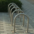 Empty bicycle parking metal rack near the road Royalty Free Stock Photo