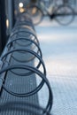 Bicycle parking ring making pleasing curves at night on train station in Denmark Royalty Free Stock Photo