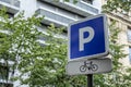 Bicycle parking sign on a city street. Close-up