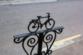 Bicycle Parking sign made of metal painted black on a city street. Metal bicycle sculpture