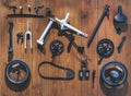 Bicycle parts lay on wooden wall background Flat lay equipment cycling tools