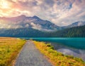 Bicycle path around Champfer lake in the Swiss Alps.