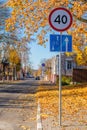 Bicycle path in the autumn cityscape on the old outskirts of the