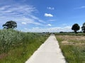 Bicycle path next to a canal around Basse