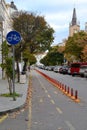 Bicycle path between the sidewalk and the roadway on a narrow street in the old part of the city. Healthy lifestyle. Cityscape on Royalty Free Stock Photo