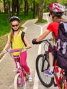 Bicycle path sign with children. Girls wearing helmet with rucksack . Royalty Free Stock Photo