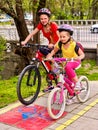 Bicycle path sign with children. Girls wearing helmet with rucksack . Royalty Free Stock Photo