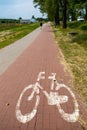 Bicycle path and sign denoting a place for bicycles. A place for active recreation Royalty Free Stock Photo