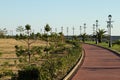 Bicycle path surrounded by tropical plants Royalty Free Stock Photo