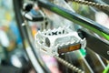 Bicycle pedal on a blurred bicycle background