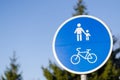 Bicycle and pedestrian lane road sign in blue Royalty Free Stock Photo
