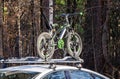 Bicycle rack with attached bicycle on roof of the car. car mounts, rails for transporting bicycles Royalty Free Stock Photo