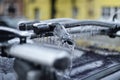 Bicycle rack on a car covered in ice after frozen rain