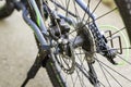 A bicycle rear wheel chain sprocket spokes disc brakes closeup Royalty Free Stock Photo