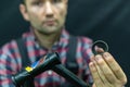 Bicycle repair. The bike mechanic changes the cups and bearings in the headset of the frame. Bicycle parts in the workshop on a Royalty Free Stock Photo