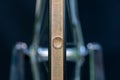 Bicycle repair. The front wheel is on a stand on a black background. Rim and spokes close-up. Mechanic levels the wheel in the Royalty Free Stock Photo